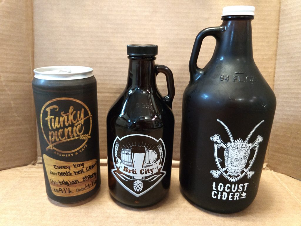 Photo showing examples of a metal crowler, glass grunt, and glass growler from left to right.