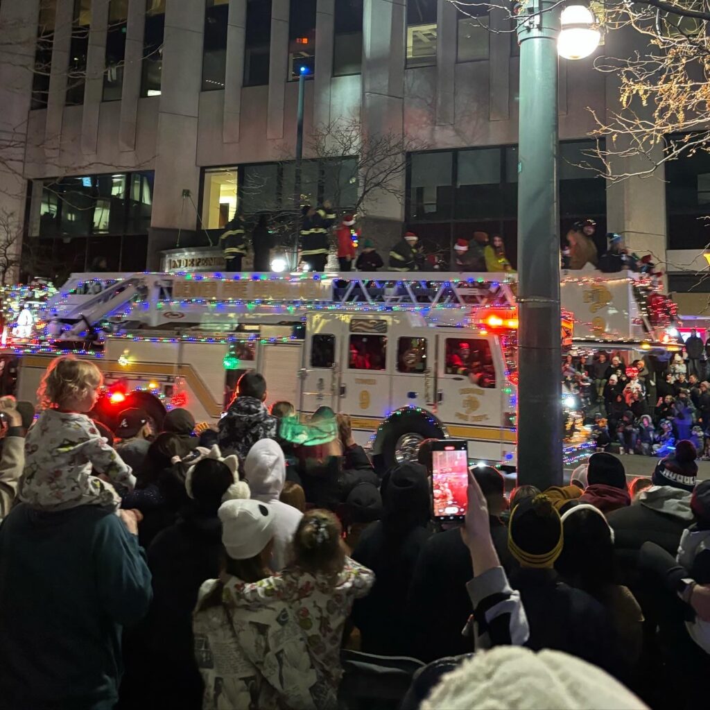 Examples of the lit parade floats, lit riders, and colorful balloons in the Denver Parade of Lights.